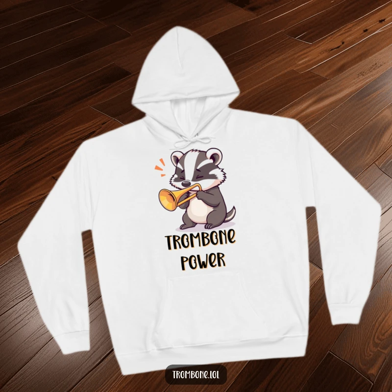 Funny badger hoodie with a determined badger intensely blowing a loud note from a trombone, embodying musical power.
